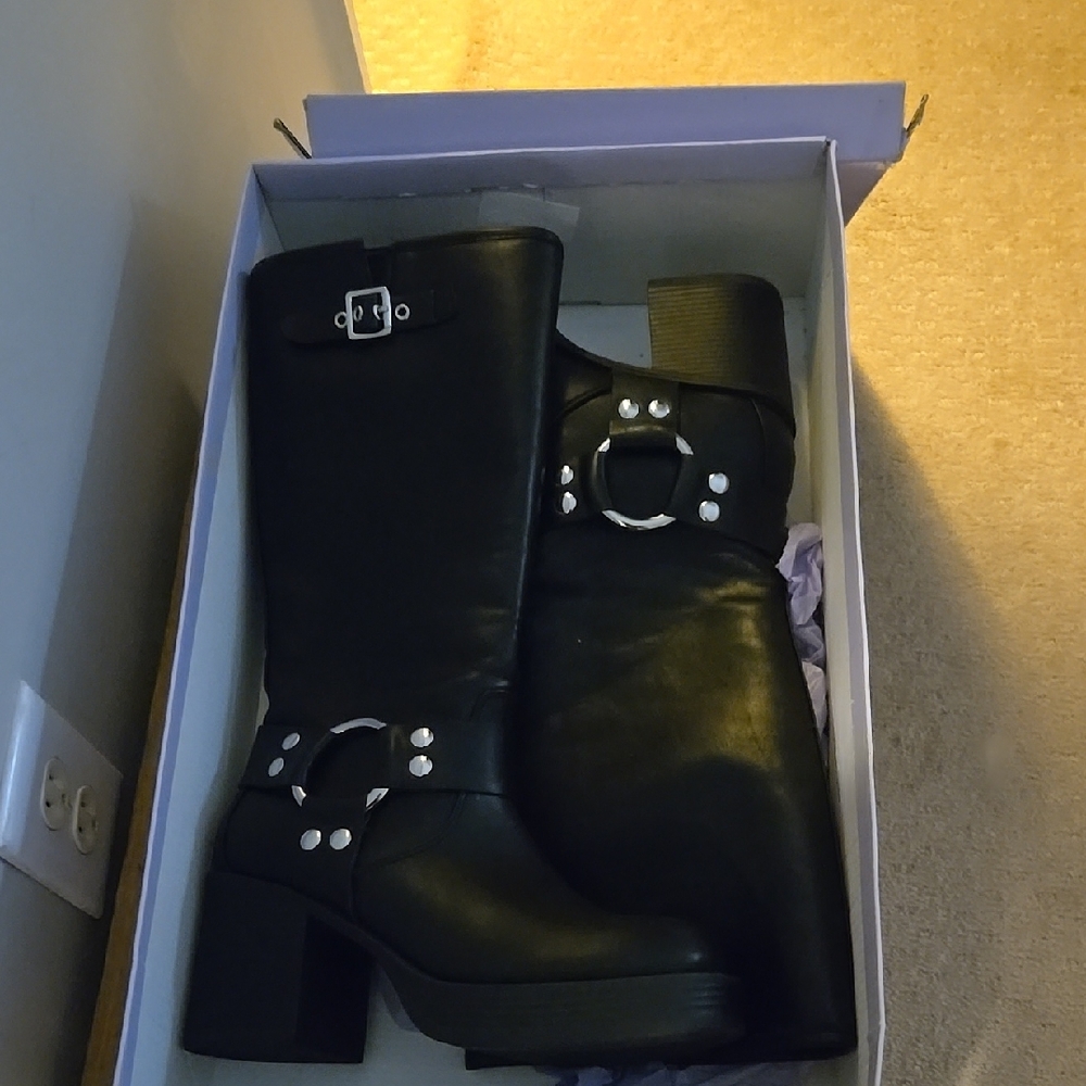 Black Heeled Boots with Circular Design Element